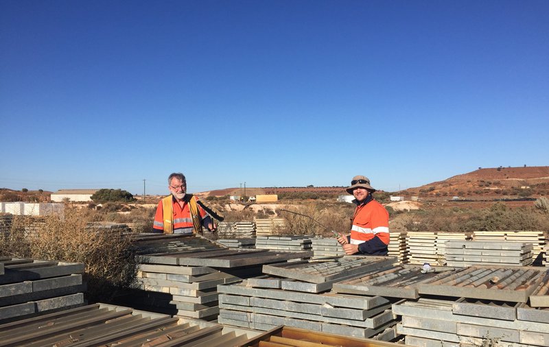 RIGHT: John Walshe and Adam Bath logging and sampling historical diamond drill core from the Mount Magnet core farm.
